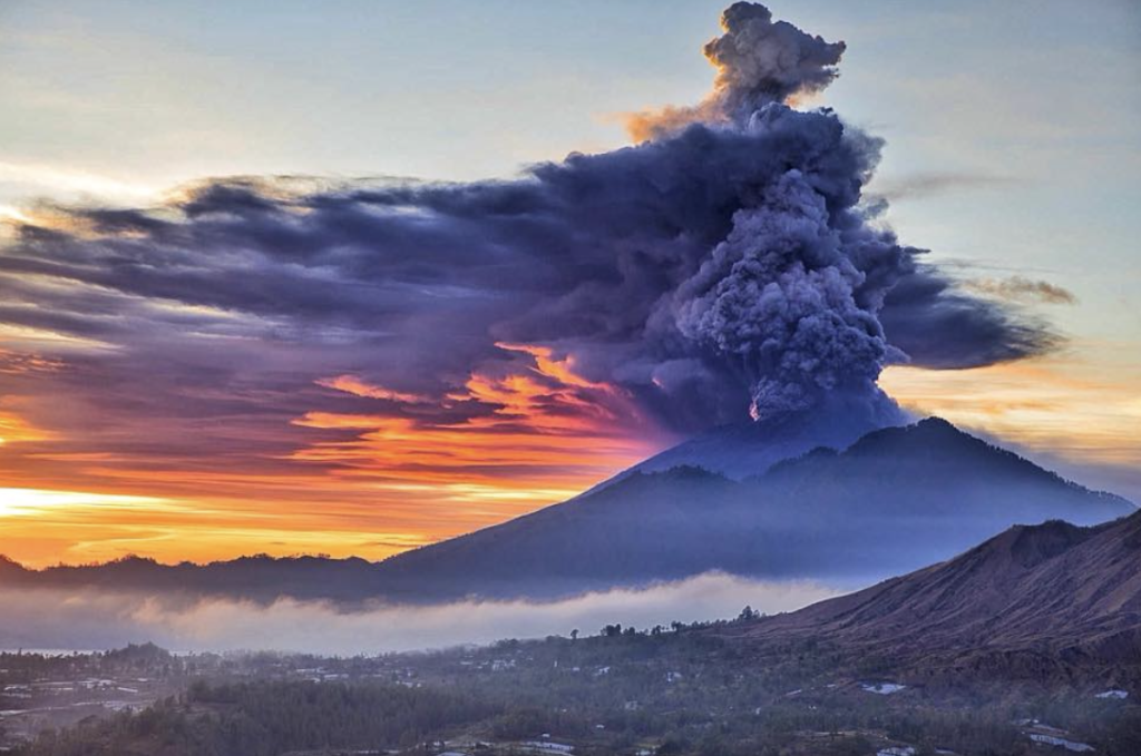 Gunung Agung erupting, Bali, with an ash column rising from the summit.